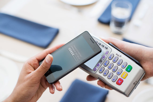 Paying with smartphone in restaurant